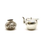 A miniature silver teapot