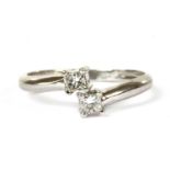 A platinum two stone diamond ring,