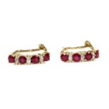 A pair of 9ct gold ruby and diamond half hoop earrings,