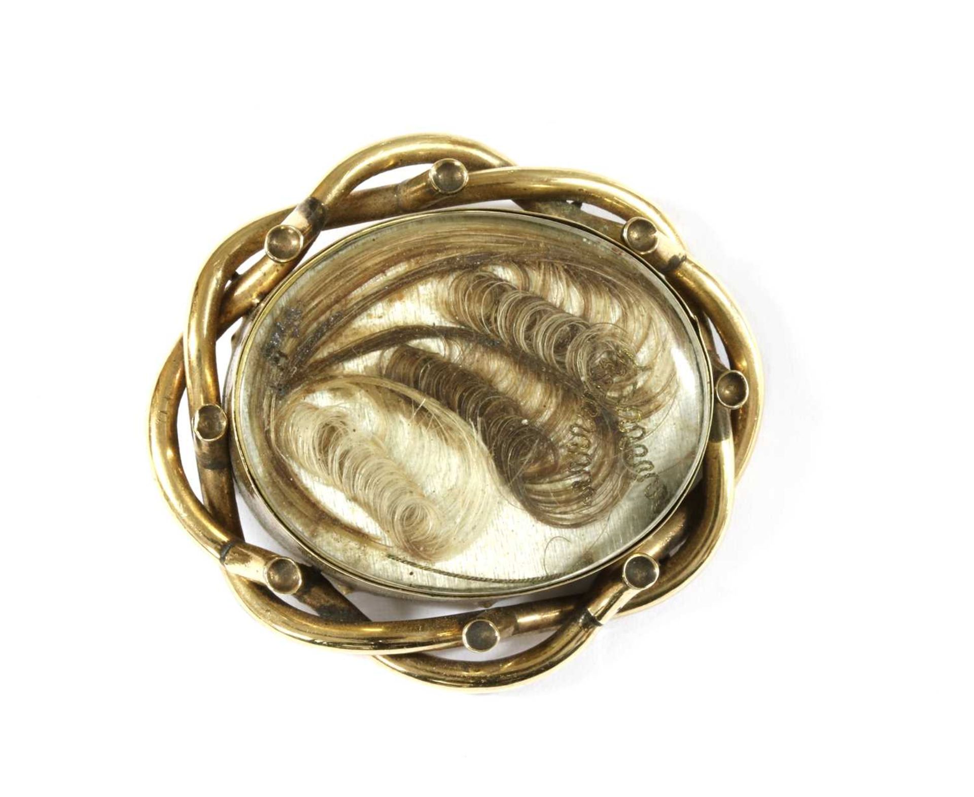 A gold mourning brooch,