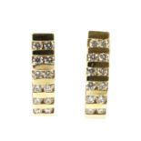 A pair of gold diamond half hoop earrings,