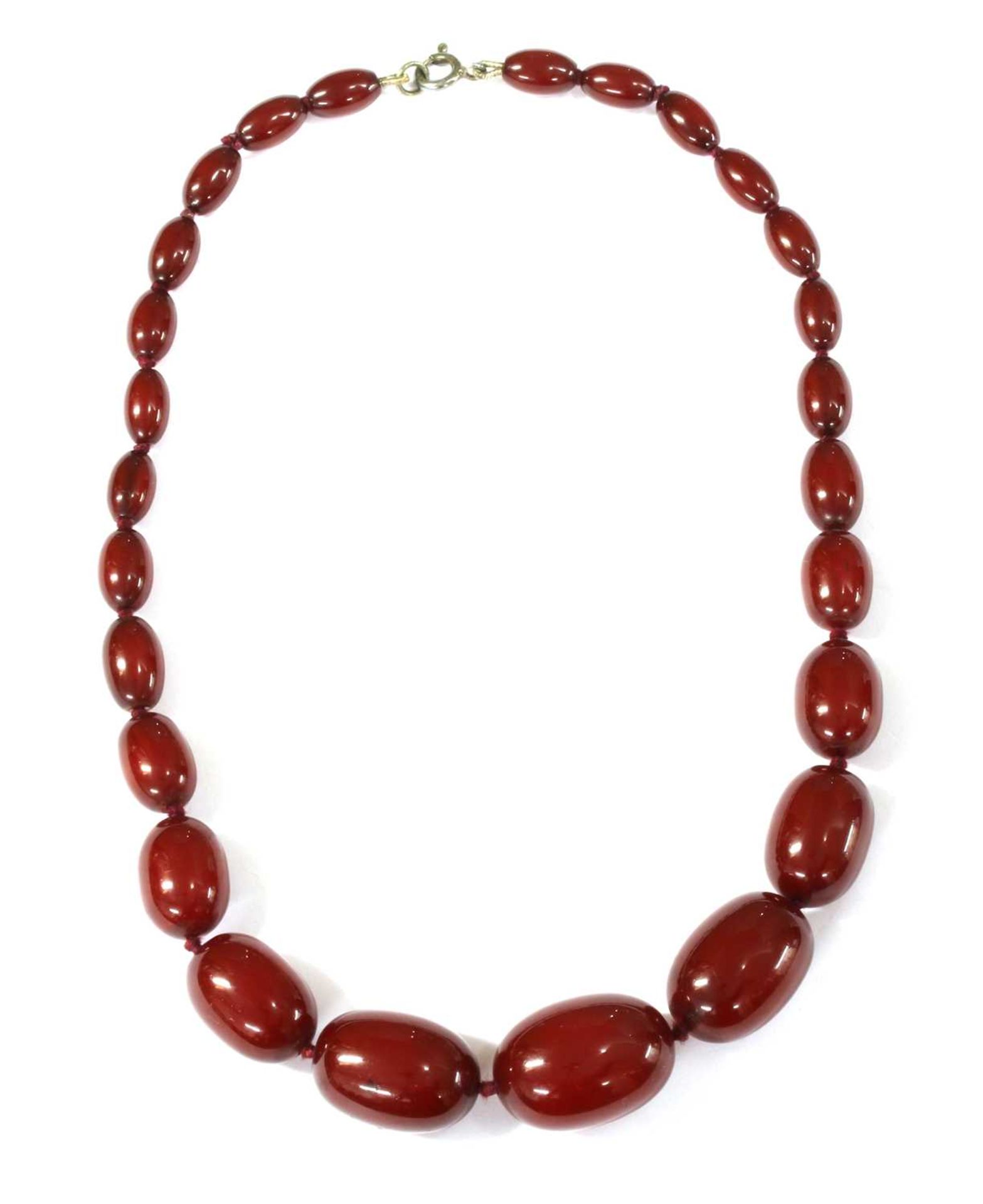 A single row graduated oval cherry coloured Bakelite bead necklace,