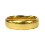 A 22ct gold light court section wedding ring,