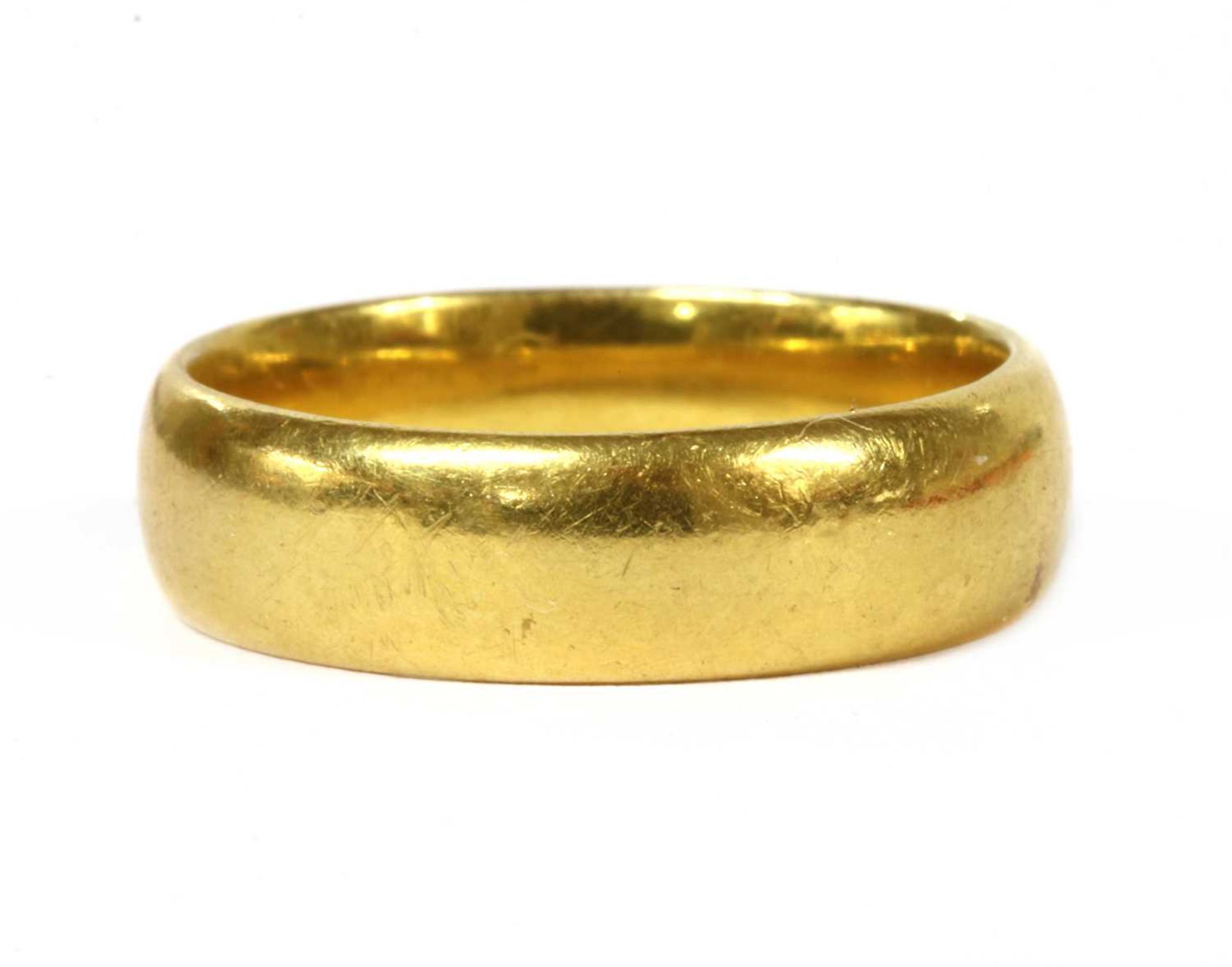 A 22ct gold light court section wedding ring,