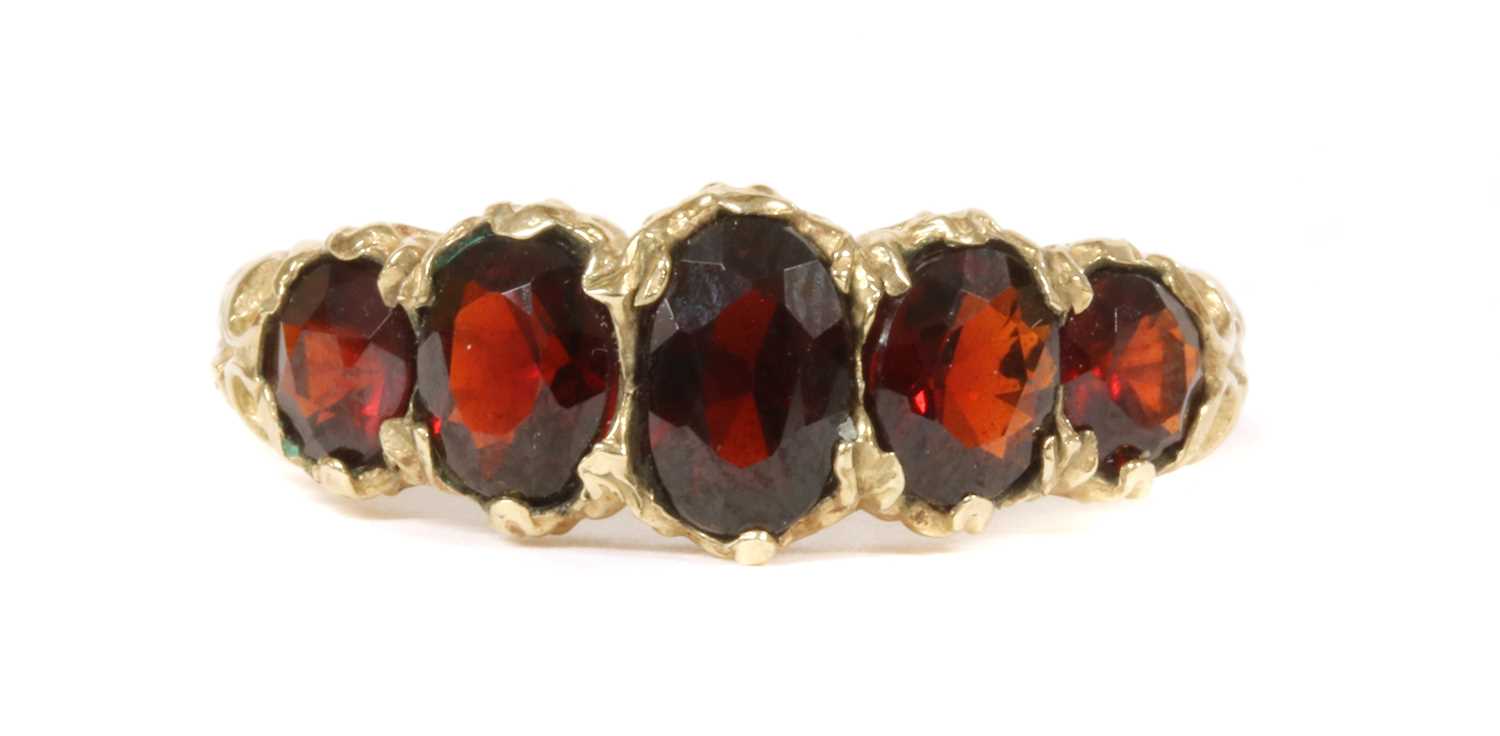 A 9ct gold five stone garnet ring,
