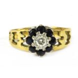 A gold diamond and sapphire cluster ring,