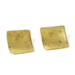 A pair of gold stud earrings,