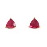 A pair of gold single stone ruby stud earrings,