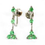 A pair of white gold green gemstone earrings,