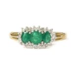 A 9ct gold emerald and diamond triple cluster ring,