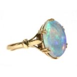 A gold single stone opal ring,