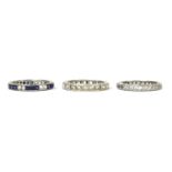 Three silver paste set full eternity rings,