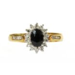 An 18ct gold sapphire and diamond cluster ring,