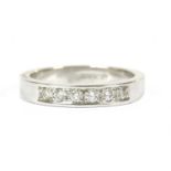A 9ct white gold diamond half eternity ring,