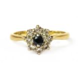 A gold sapphire and diamond cluster ring,