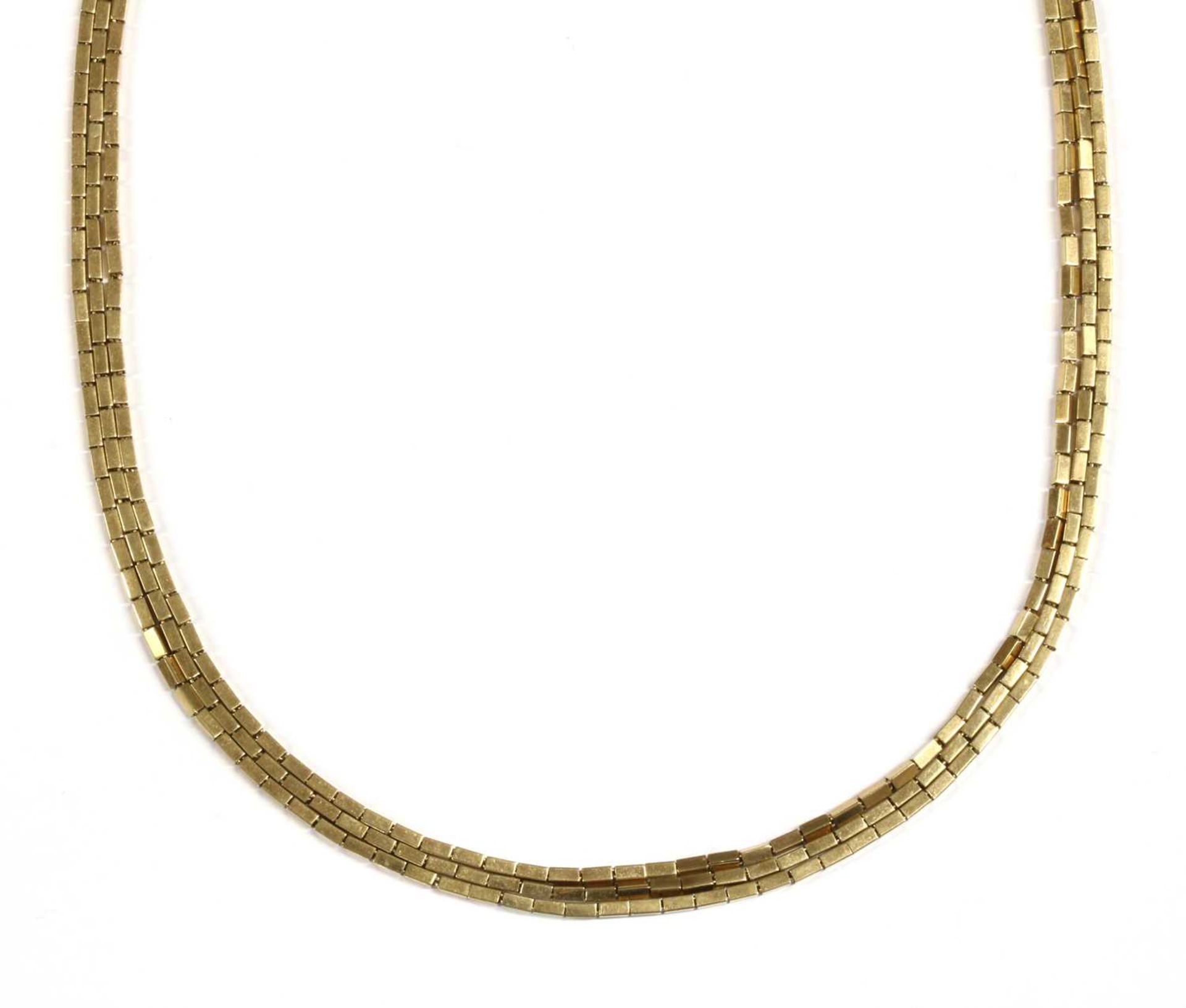 A gold three row necklace,