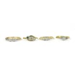 A gold three stone diamond ring,