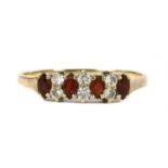 A 9ct gold garnet and cubic zirconia ring,