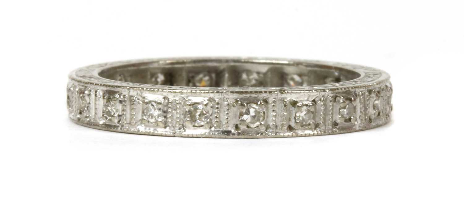 A white gold diamond full eternity ring,