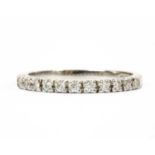 An 18ct white gold diamond half eternity ring,