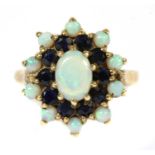 A 9ct gold opal and sapphire cluster ring,