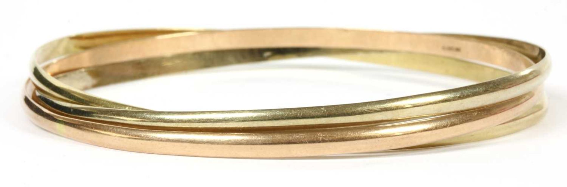 A three band three colour gold bangle,