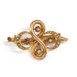 A gold split pearl brooch,