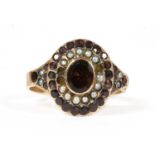 A Victorian gold garnet and split pearl cluster,
