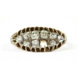 A gold boat shaped diamond ring,