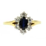 An 18ct gold sapphire and diamond cluster ring,