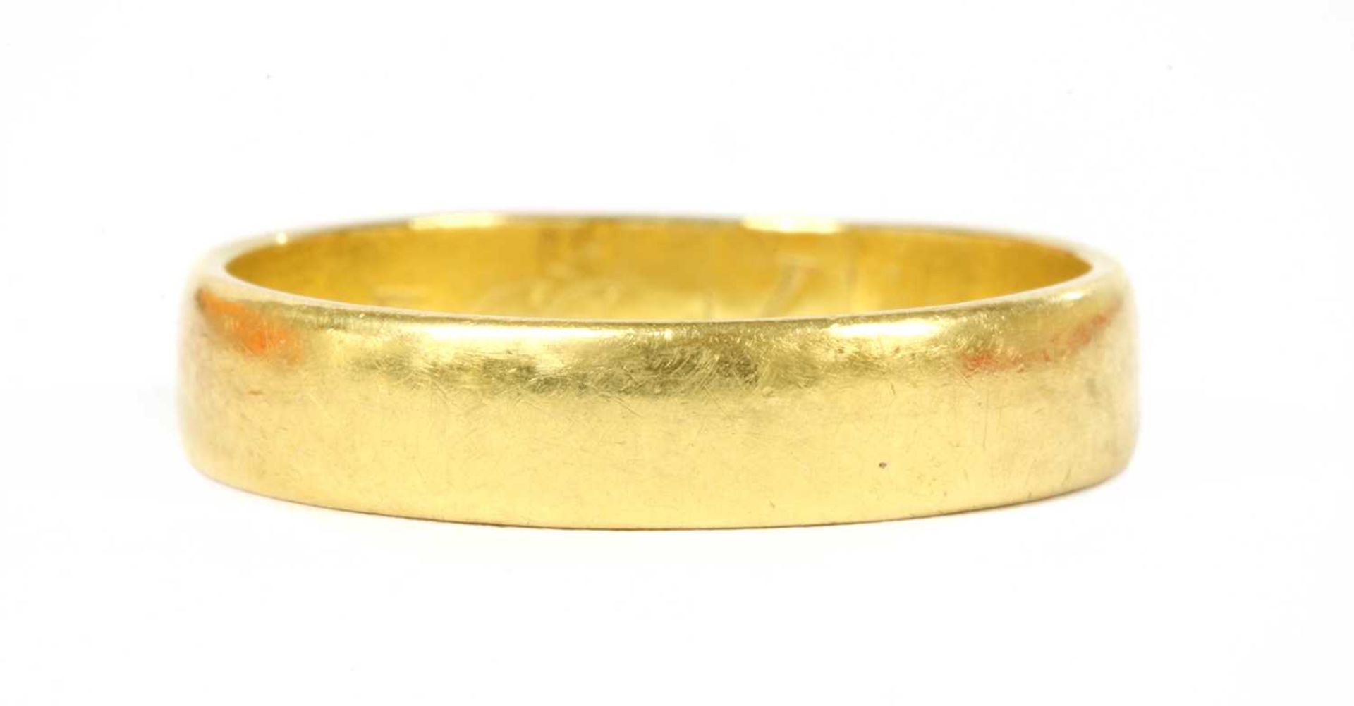 A 22ct gold flat section wedding ring,