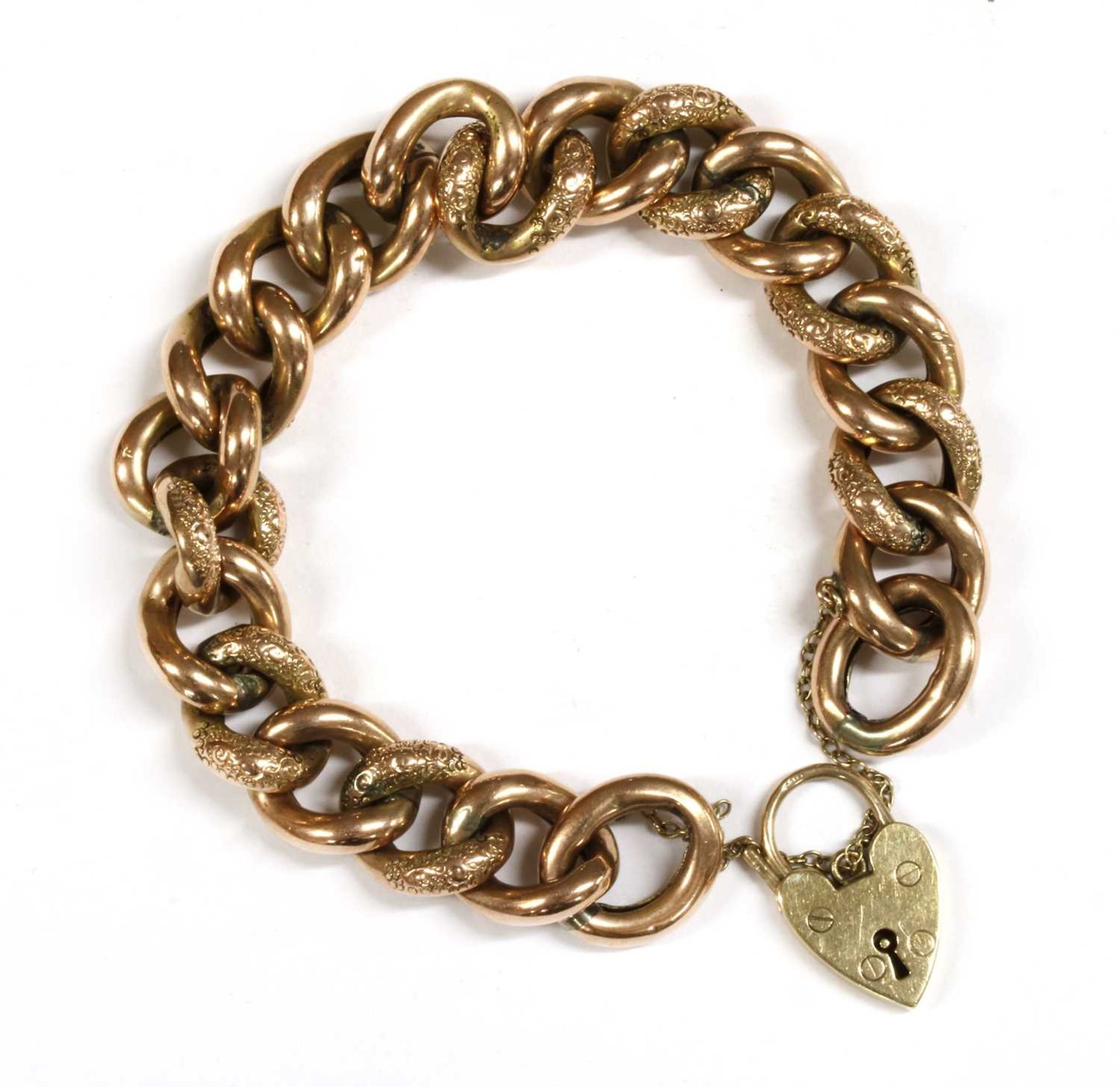 A gold hollow curb link bracelet,