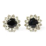 A pair of white gold sapphire and diamond cluster earrings,