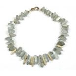 A contemporary silver and coated quartz crystal necklace,