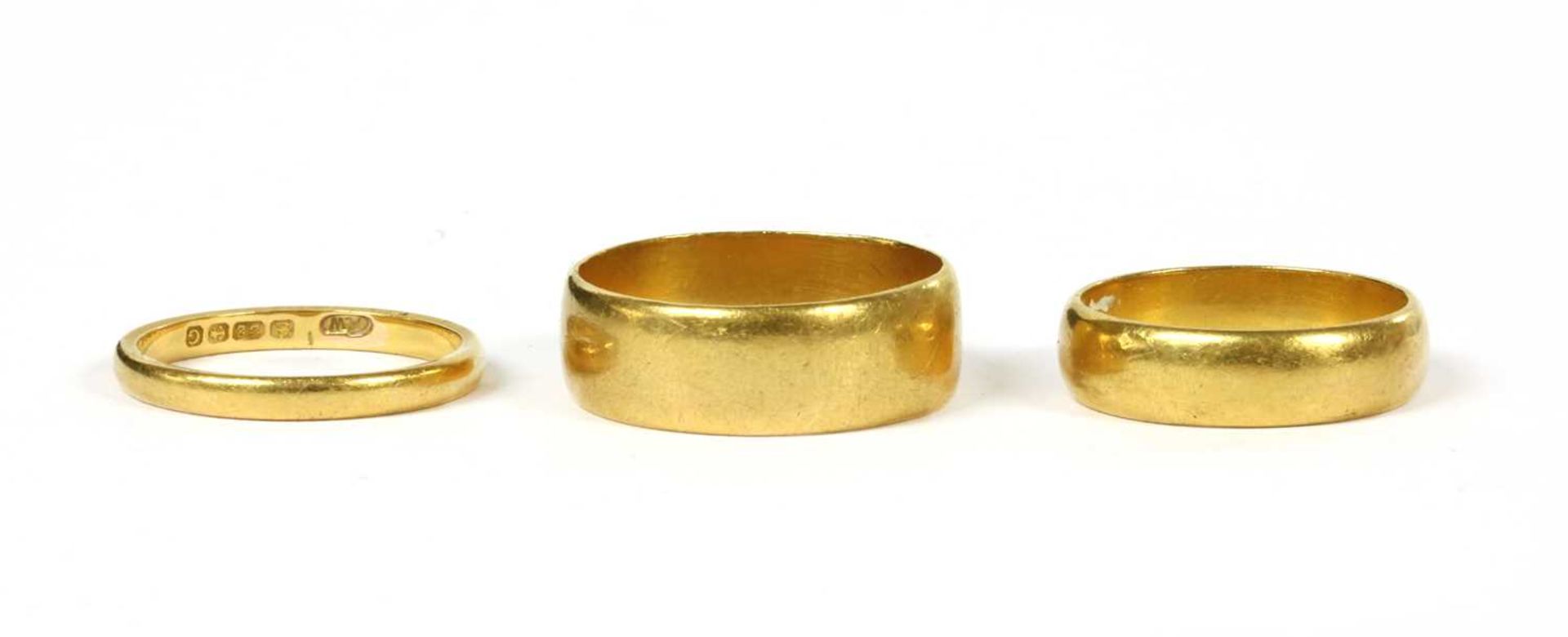 Three 22ct gold wedding rings,