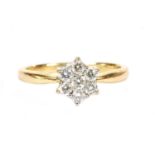 An 18ct gold diamond daisy cluster ring,