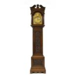 An oak musical longcased clock,