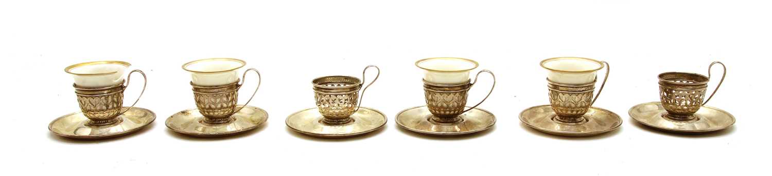 A set of six silver liquer glass holders,