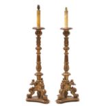 A pair of modern giltwood standard lamps in the form of candlesticks