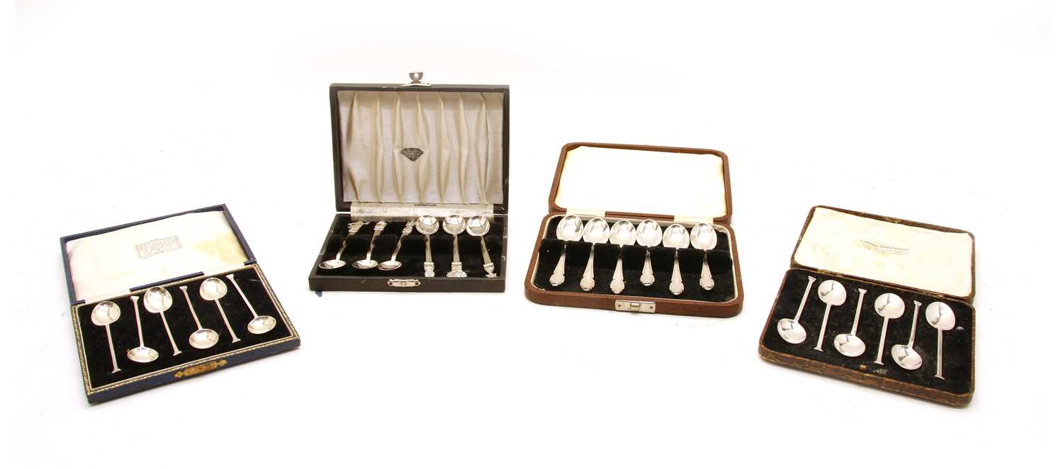 A collection of cased silver teaspoons,