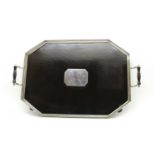 A silver plated and ebony twin-handled galleried tray,