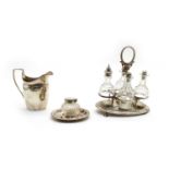 Three silver items comprising a Georgian helmet shaped cream jug,
