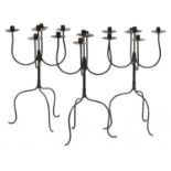 A set of three steel five-light candelabra,