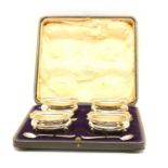 A cased set of four silver open salts,