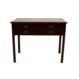 A George III mahogany side table of three drawers