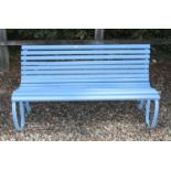 A blue painted scrolling garden bench,