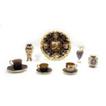 Four miniature Coalport cabinet cups and saucers