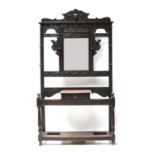An early 20th Century carved oak hallstand,