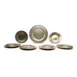 A set of six 18th century pewter plates, together with a larger example (7)