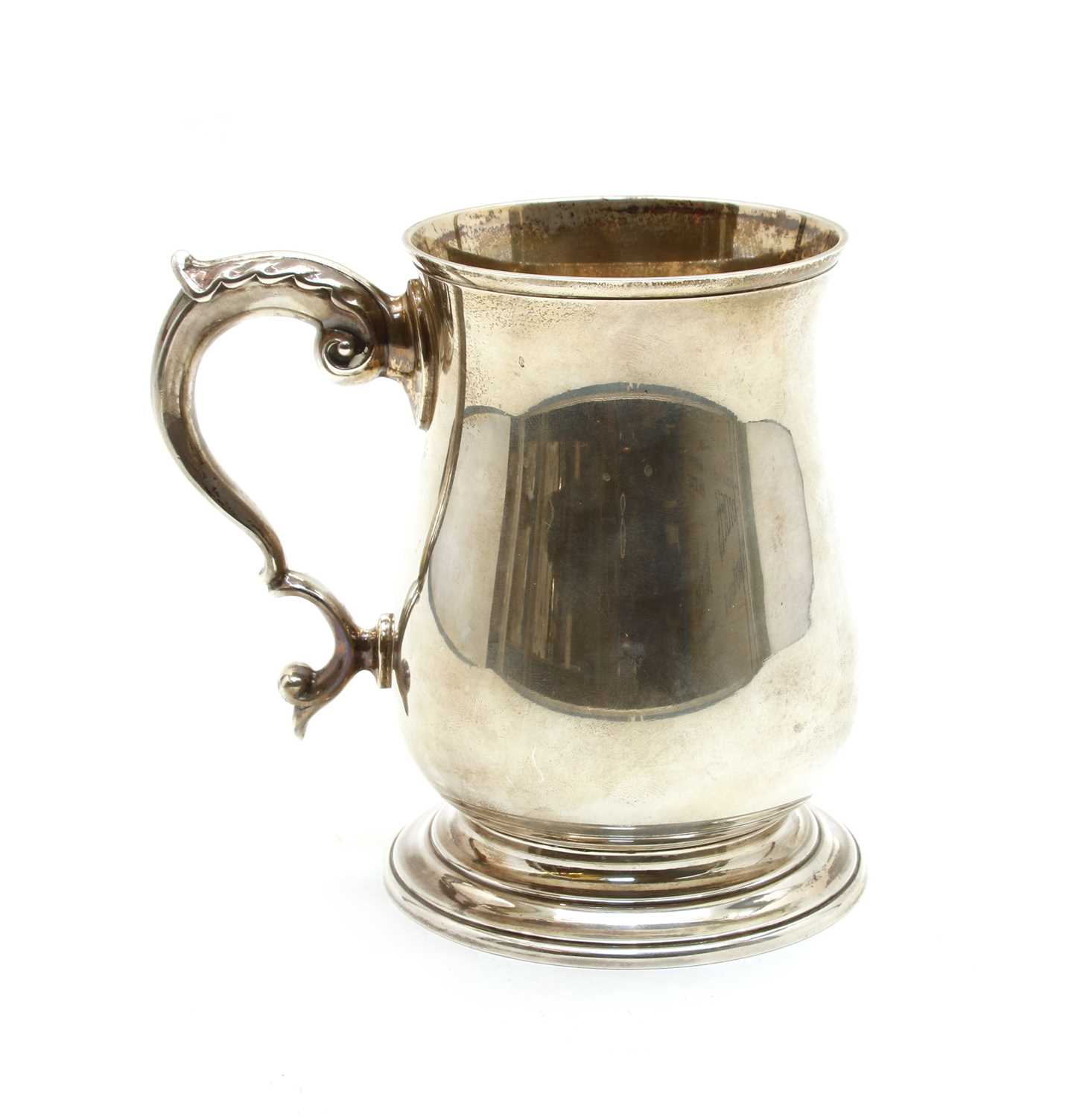 A silver tankard of folded baluster form,